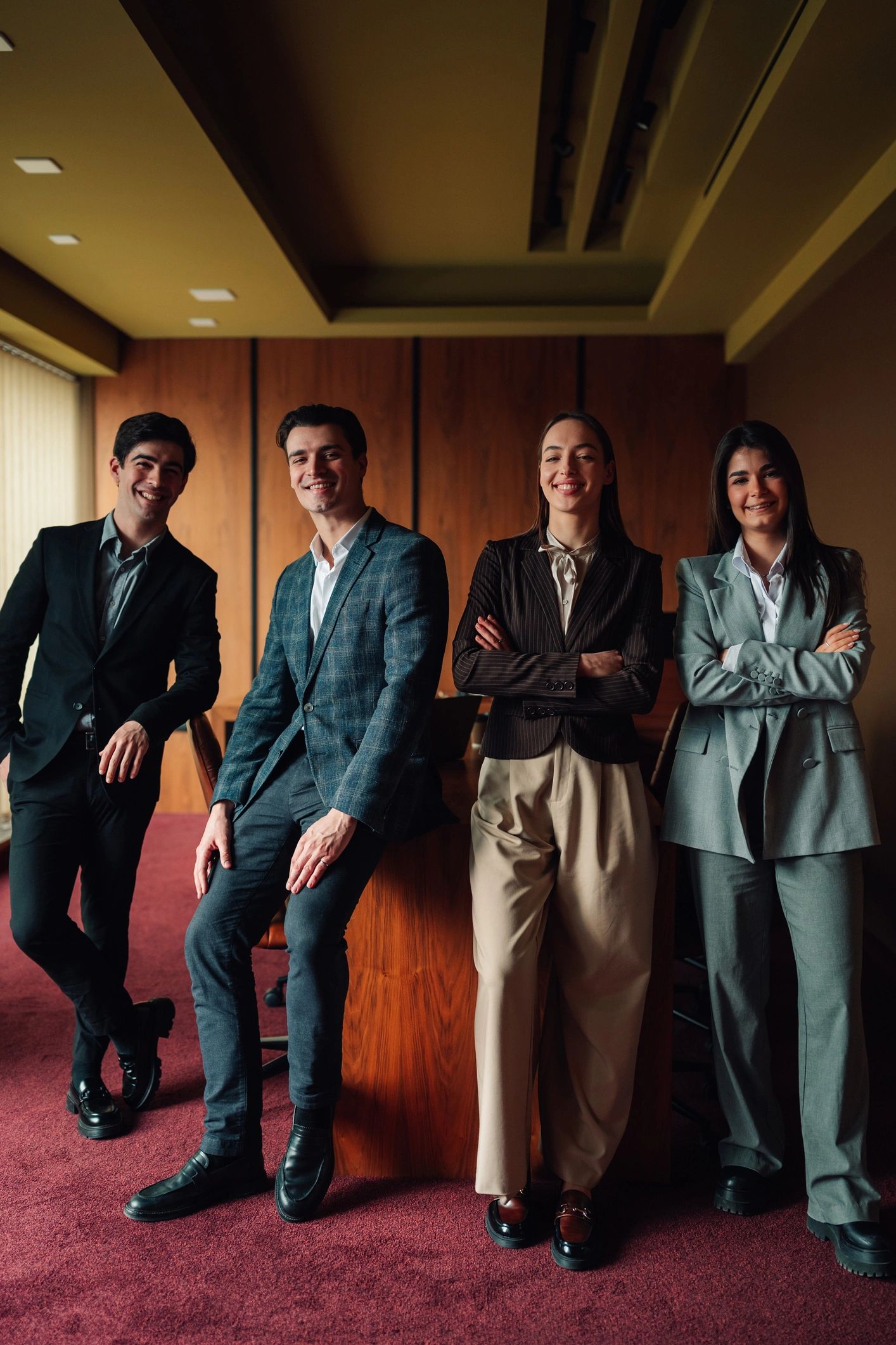 Professional consulting team standing together in a modern office